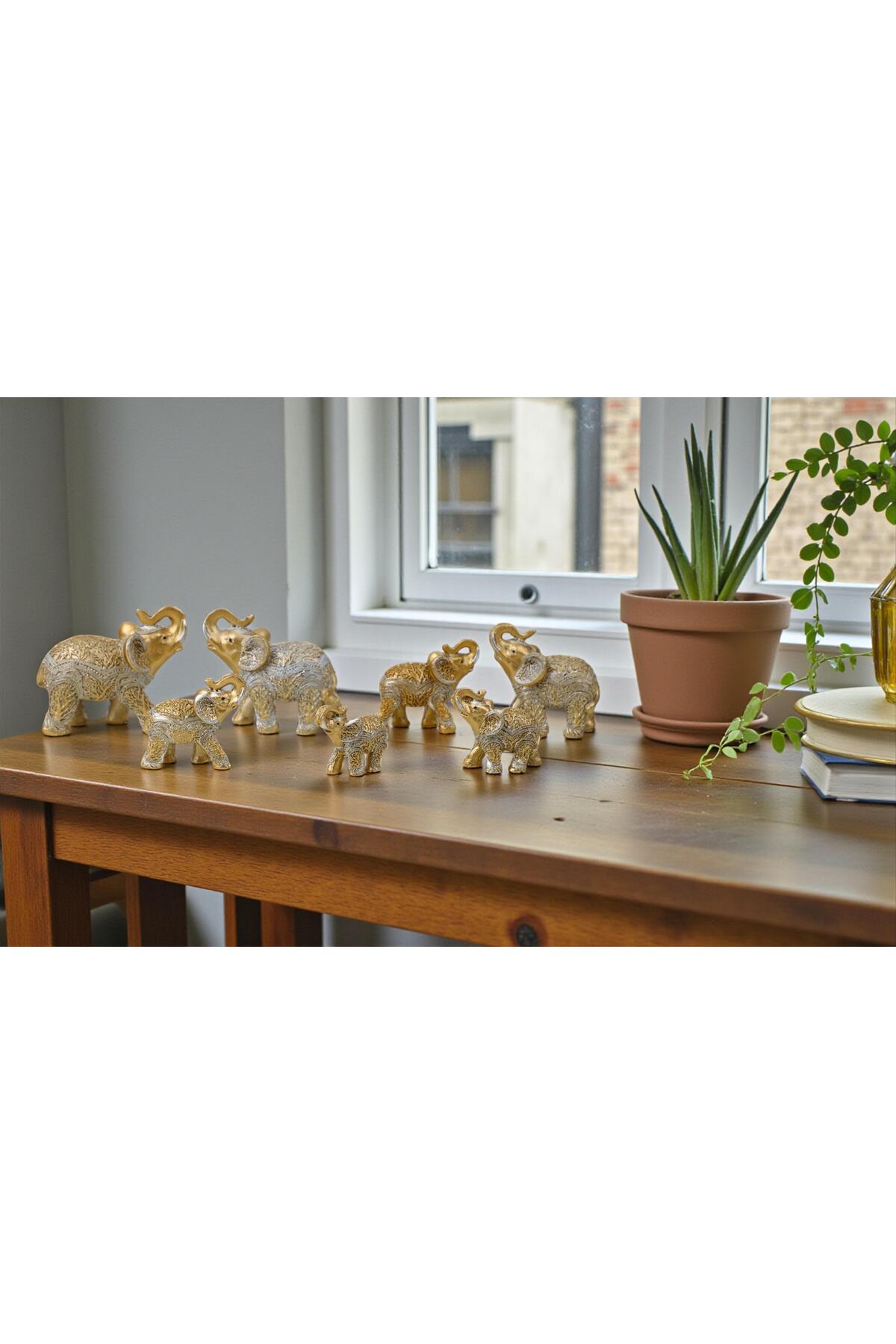 Elephant figurines on a wooden table