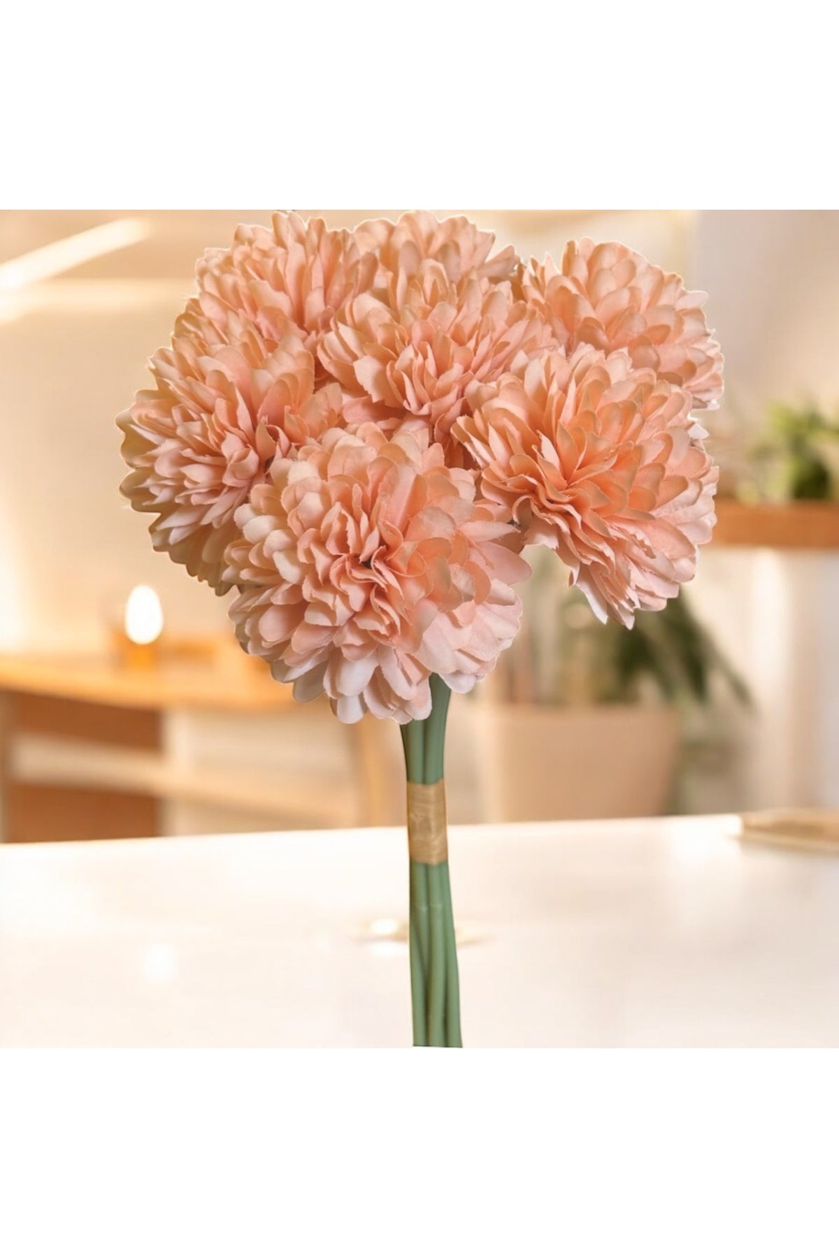 Peach chrysanthemum balls in a vase