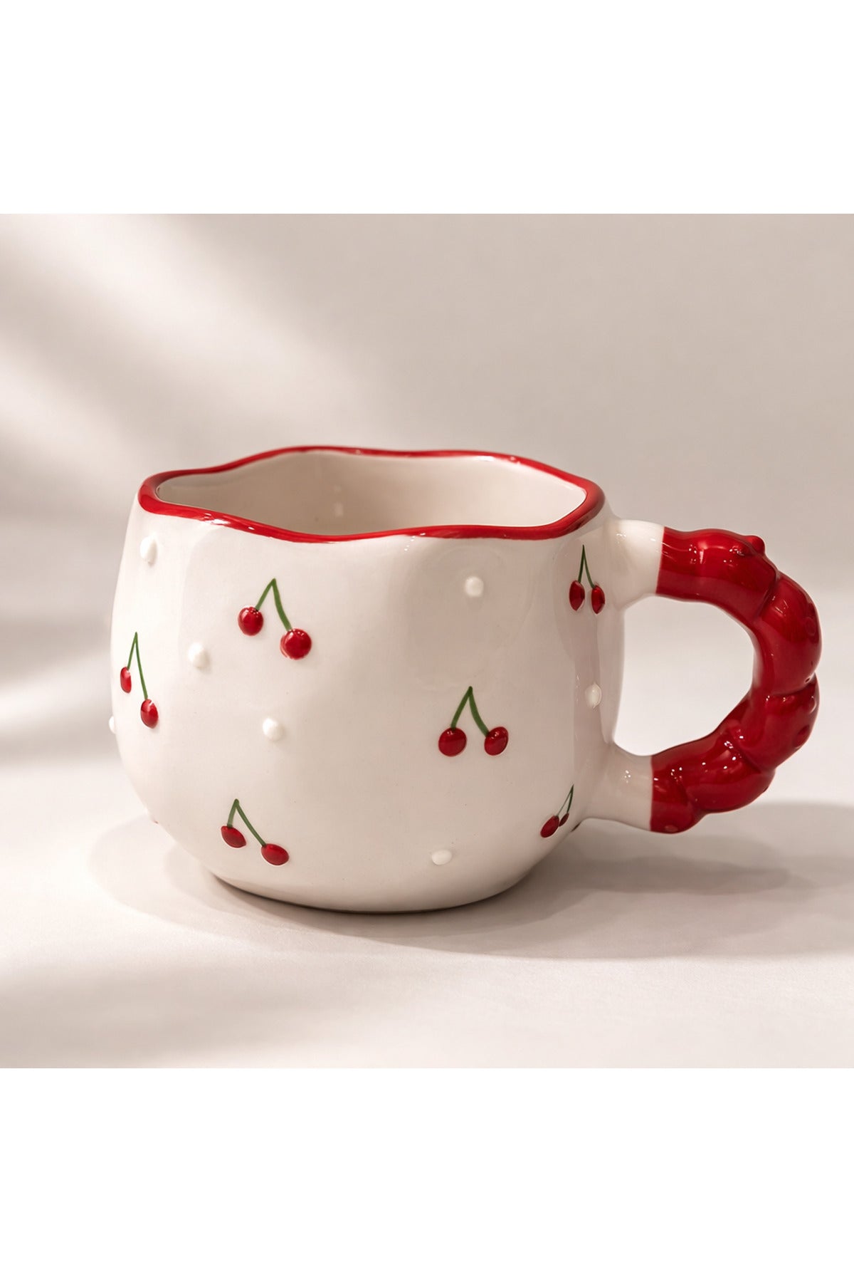 Handmade ceramic cherry mug with red handle