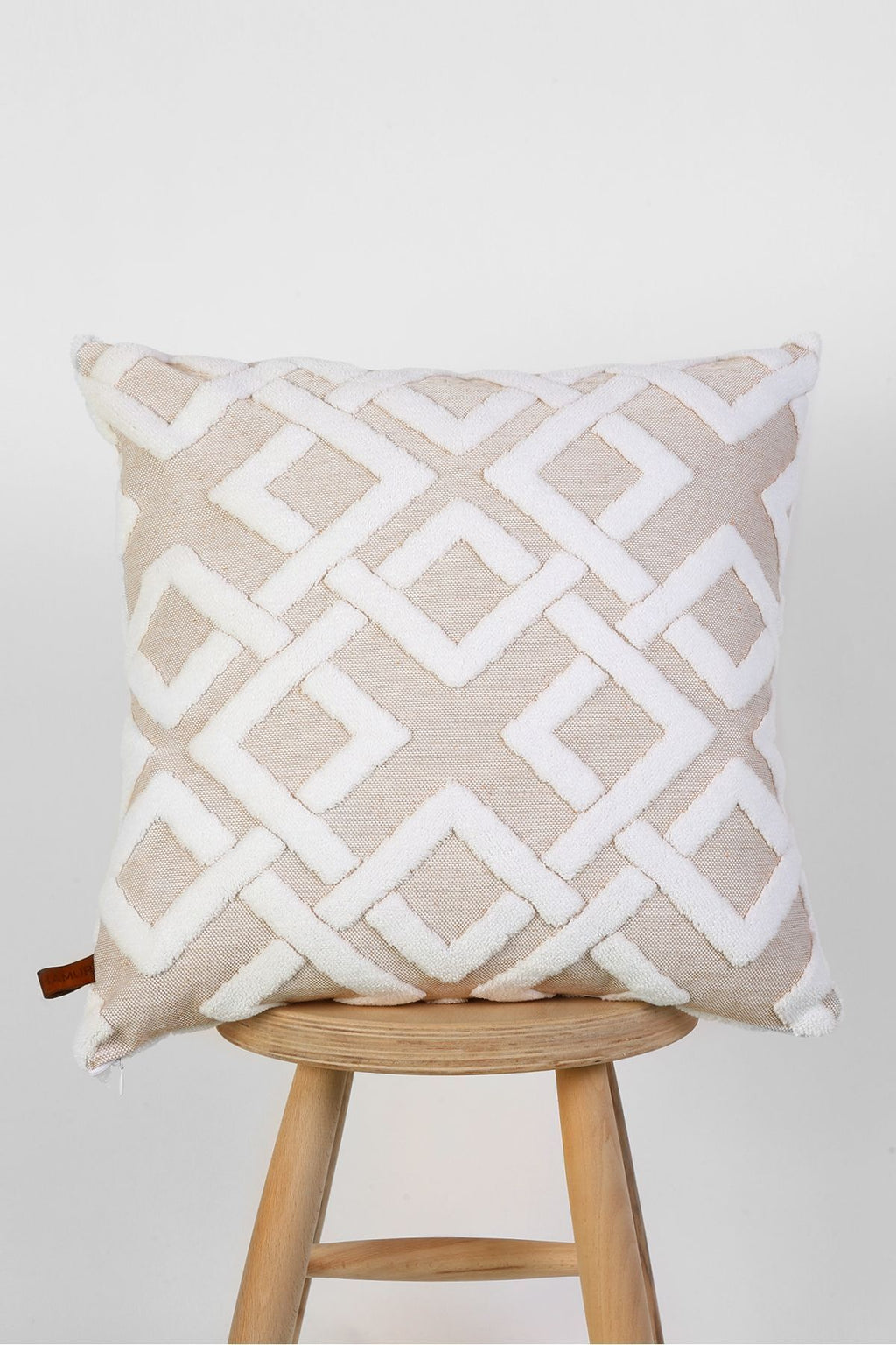 Beige lattice cushion on a stool