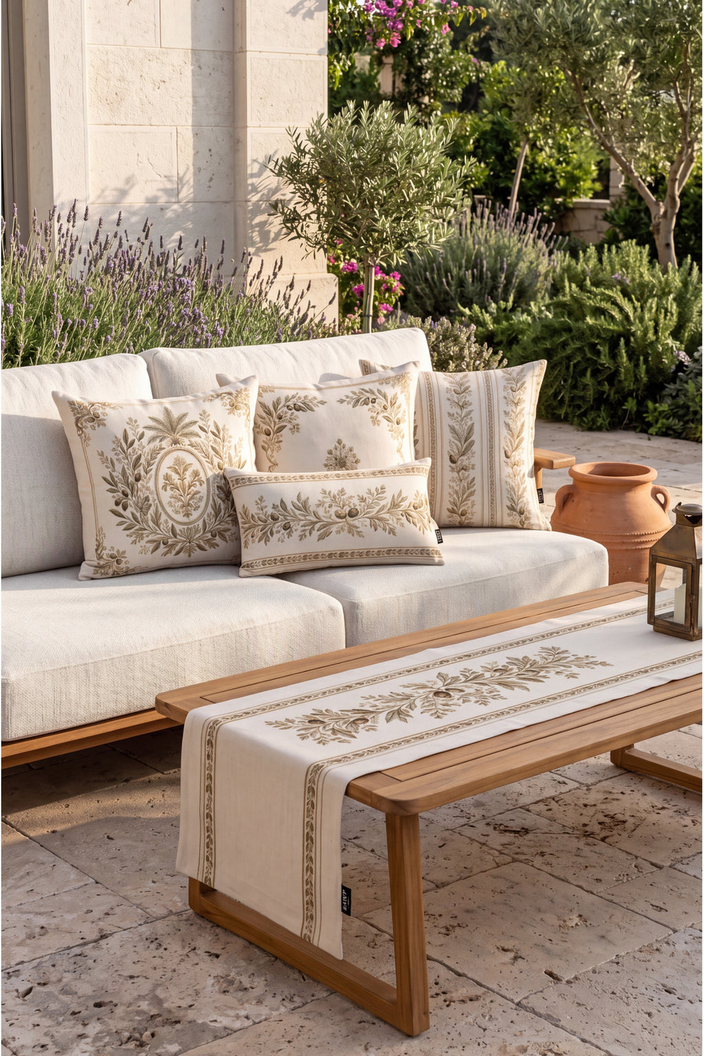 Olive branch cushions on a cream sofa