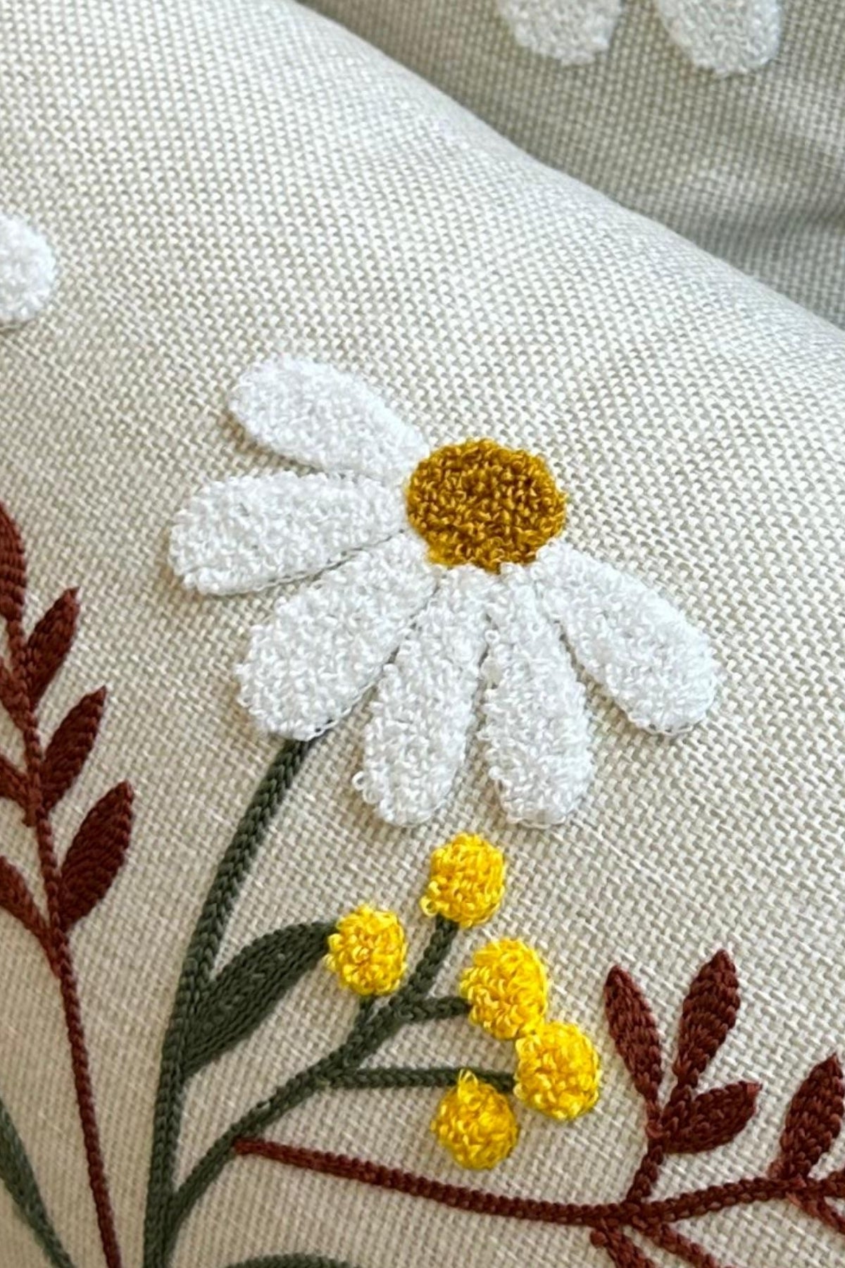 Tufted daisy embroidery close-up