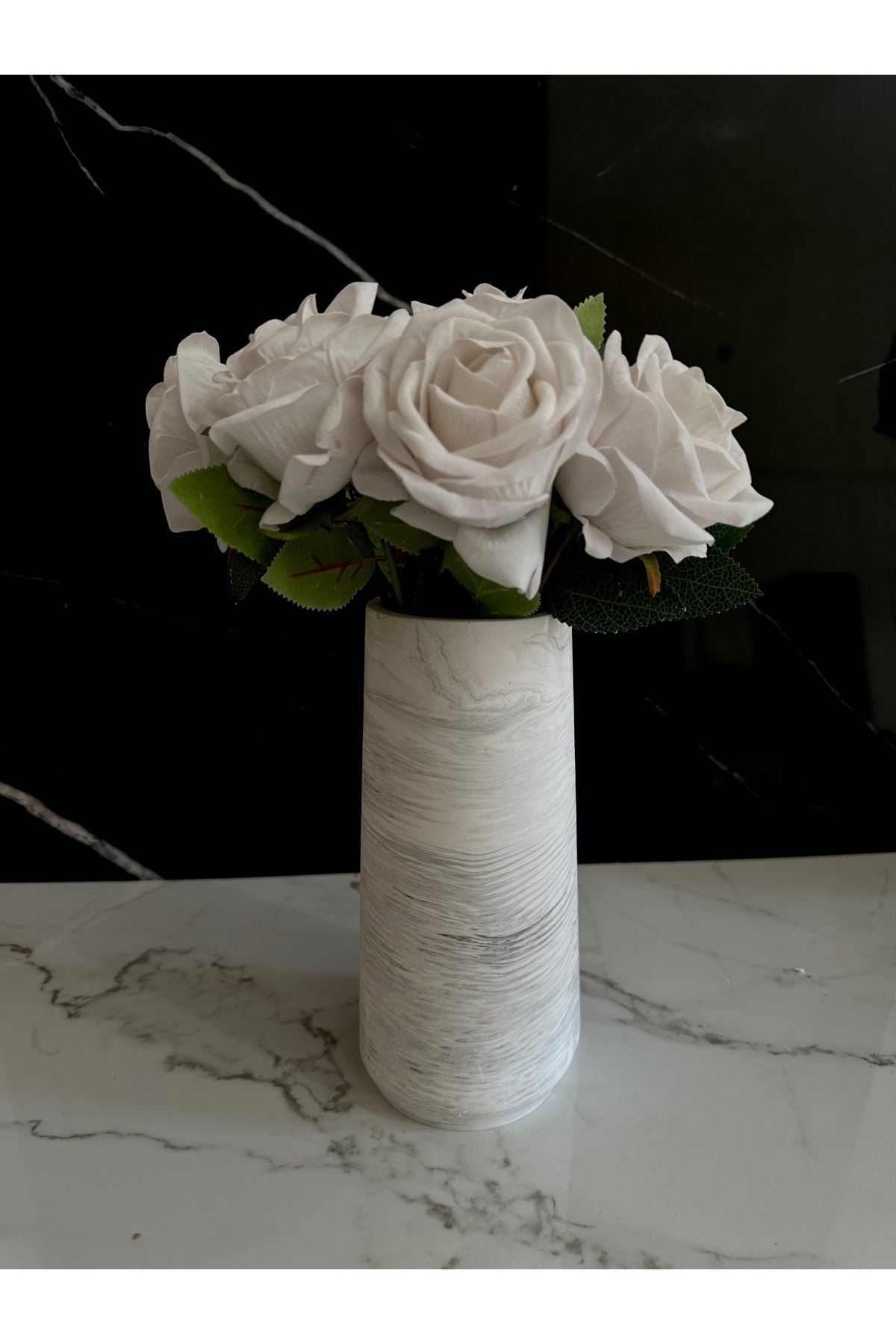 Grey concrete vase with plants